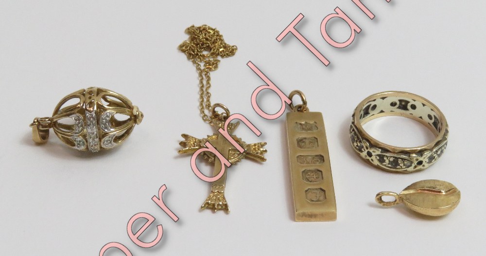 A 9 carat gold egg pendant, set with single cut diamonds; a 9 carat gold ingot pendant; a 9 carat