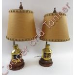 A pair of ships lanterns each mounted as a ships lantern