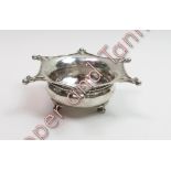 Omar Ramsden, a silver salt, London 1922, the bowl with a hexafoil rim having bead points, on