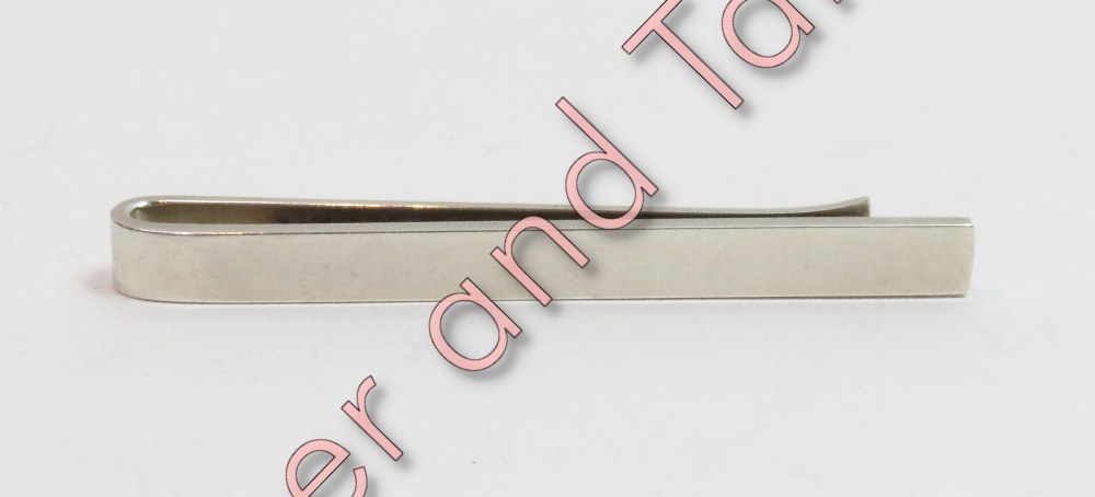 A Georg Jensen silver tie slide, of plain form, model 84A, with import marks for 1973, 5.8cm long