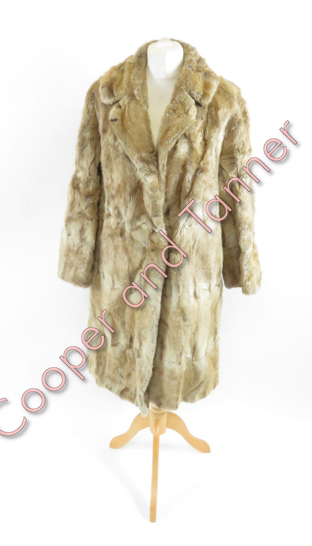 A vintage fur coat by the National Fur Company, along with faux fur coat