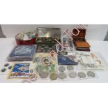 A collection of coins, mostly Victorian and later loses coins, along with various coins sets