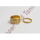 A wide 22 carat gold patterned wedding ring; and a narrow 22 carat gold plain wedding ring; 15 g