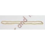 A uniform row of simulated pearls to a 9 carat gold clasp