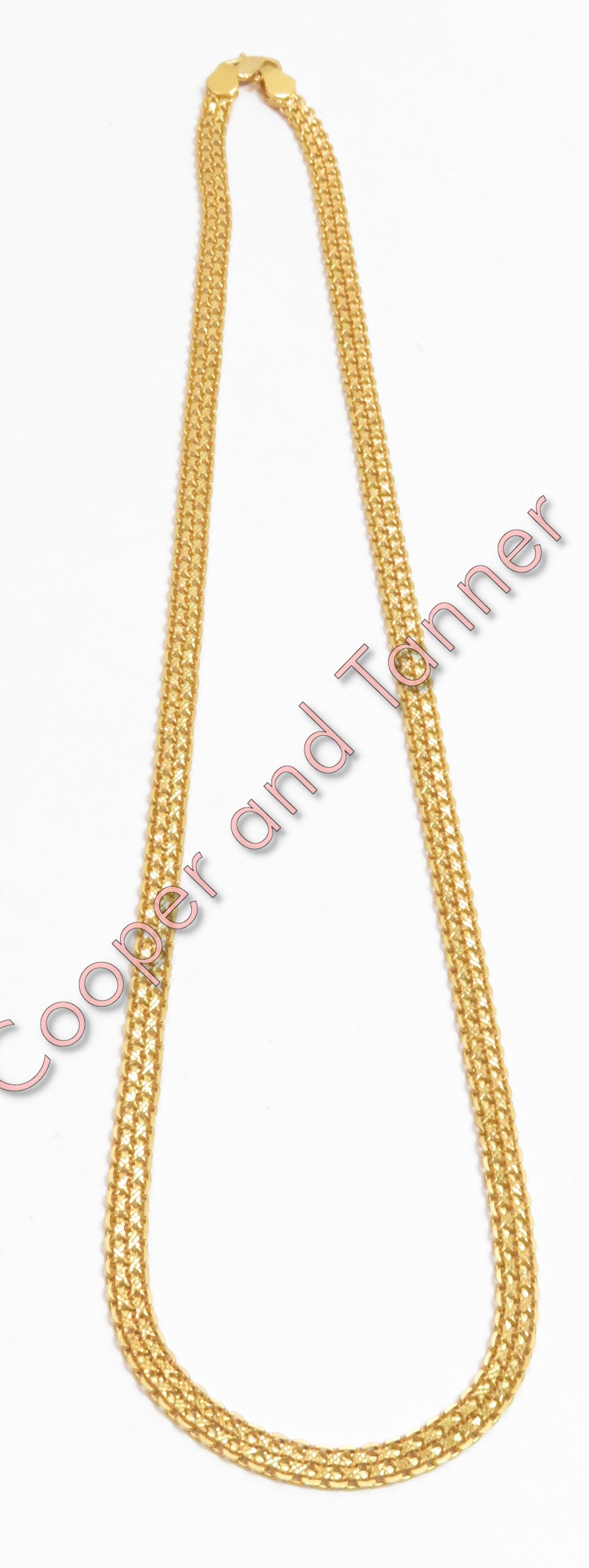 An Indian gold chain, stamped '22K', of fancy flat links, 47 cm long, 18.6 g gross