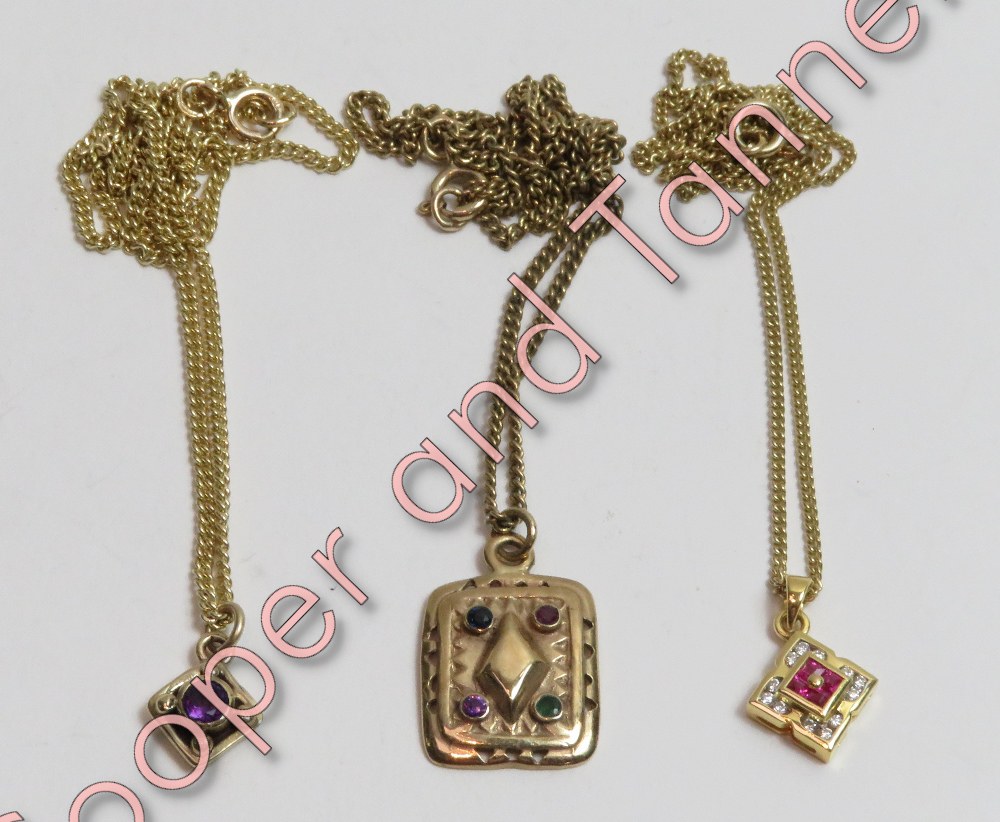 A 9 carat gold pendant on chain, matching the earstuds in lot 95; another gem set 9 carat gold