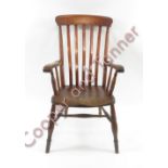 A 19th century Windsor elbow armchair, with an elm seat