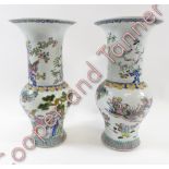 A near pair of Chinese vases, each decorated with various figures and coloured enamels, each with