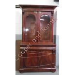 A Victorian mahogany library bookcase, with a glazed top section, single long drawer and two