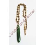 A watch chain, with indistinct marks, with a nephrite Maori club (Mere) charm attached, 34cm long,