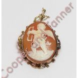 A late Victorian shell cameo brooch, stamped '9ct', carved as Cupid to a scroll border frame, 4.