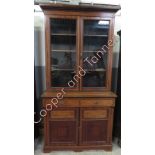 A Victorian rosewood glazed inlaid library bookcase, with two single short drawers and two door