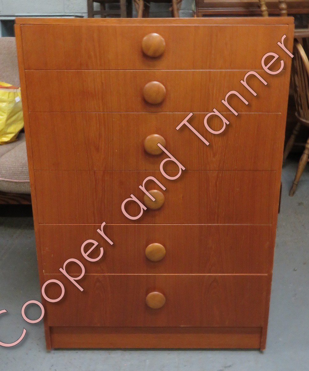 A mid century teak six drawer chest of drawers, 102cm high, 68cm long, 43cm deep
