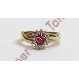 A 9 carat gold ruby and diamond cluster ring, the oval cut enclosed by single cut diamonds, finger