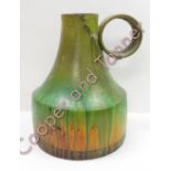A green drip glazed brutalist stoneware vase with oversized round handle, signed to the base Fantoni