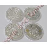 Three UK and Commonwealth encapsulated commemorative coins, years - 2005, 2007 and 2010; together