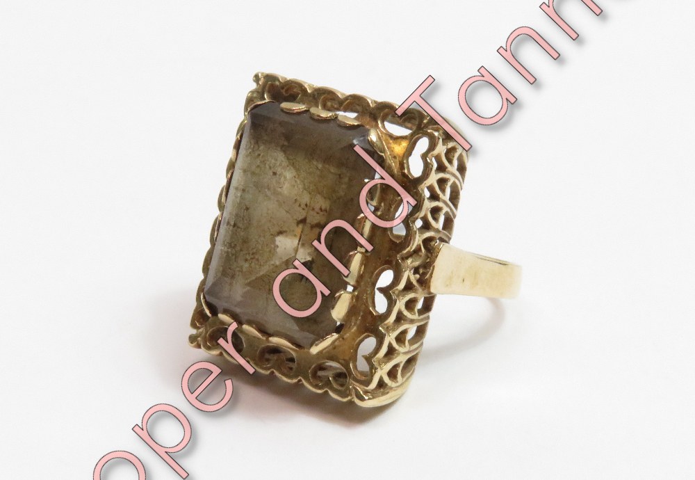 A smoky quartz single stone dress ring, stamped '9ct', finger size M, 7.3 g gross