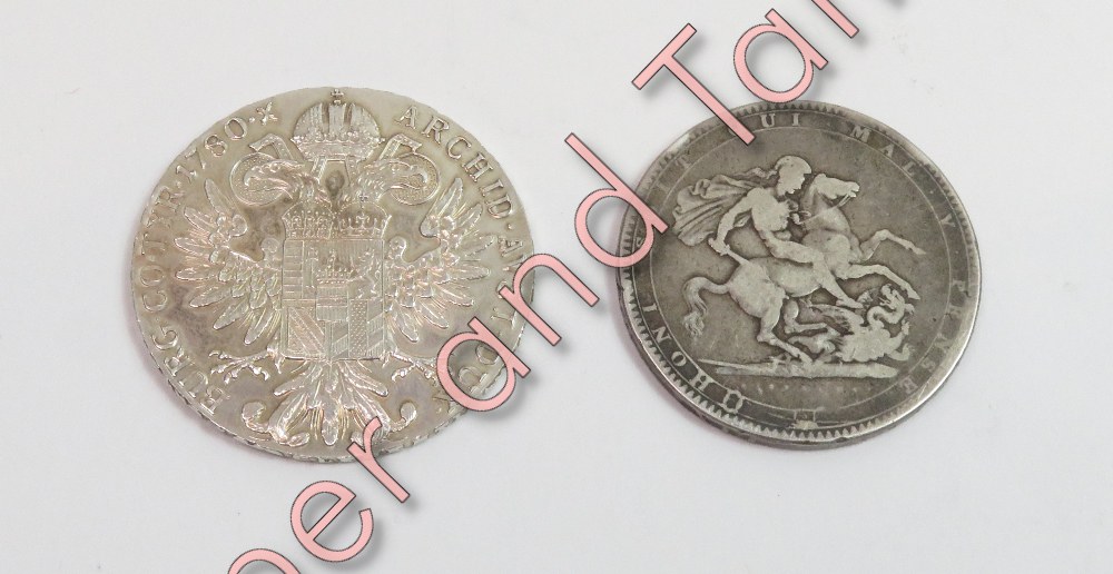 An 1819 George III crown, together with a silver 1780 Maria Theresa Thaler trade coin, inscribed '