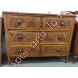 A 19th century chest of drawers, the top inlaid with two-star motifs standing on tearing legs with