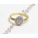 A diamond cluster ring, stamped '18K', the head set with four Princess cuts to the centre,