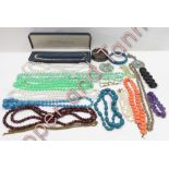 A collection of assorted costume jewellery, fashion watches and a white metal stone set box