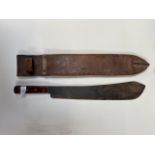 A WWII period machete machete stamped “S & J KATCHIN Ltd, Sheffield 1942” in a leather scabbard