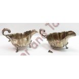 A pair of silver sauce boats, by Deakin & Deakin, Chester 1902, cur rim fluted form with leaf capped