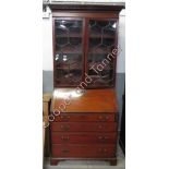 A Victorian mahogany bookcase bureau, with fall front section with four long drawers, 217cm high,