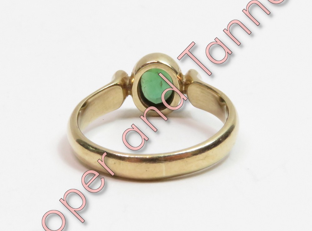 A 9 carat gold green tourmaline and diamond three stone ring, the oval cut with a brilliant cut - Image 3 of 3