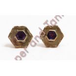 A pair of 9 carat gold amethyst earstuds, the hexagonal cut stone to a similarly shaped wide