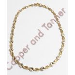 A two colour 9 carat gold collar, with a hidden box clasp and safety catch, 41 cm long, 18.4 g