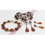 An amber bracelet; another amber set bracelet; and two pairs of amber drop earrings