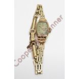 Avia, a lady's 9 carat gold mechanical wrist watch, on a metal bracelet