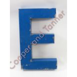 A metal shaped letter “E”, 73cm x 41cm