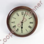 An oak cased wall clock with roman numerals