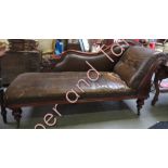 A Victorian chaise longue in brown vinyl cover