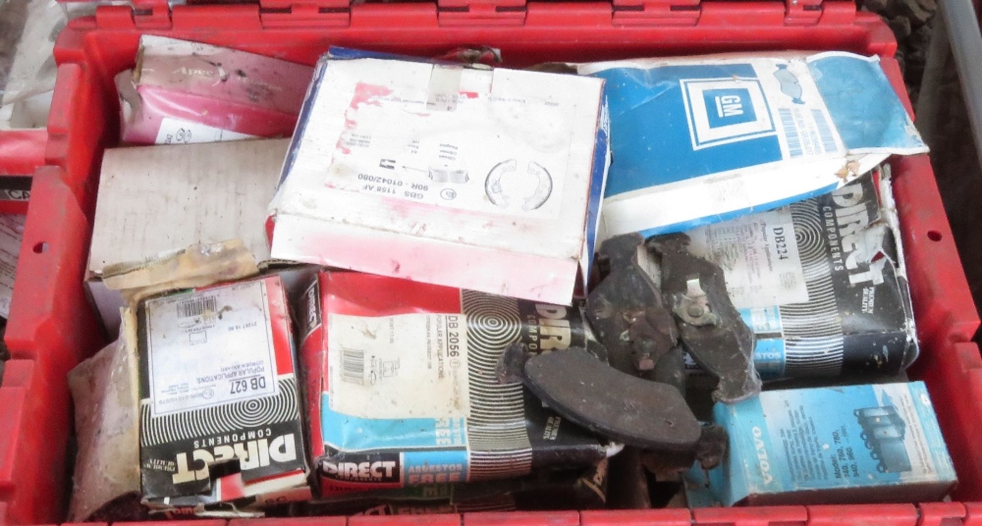 Red chest containing unused and still boxed brake pads for various vehicles