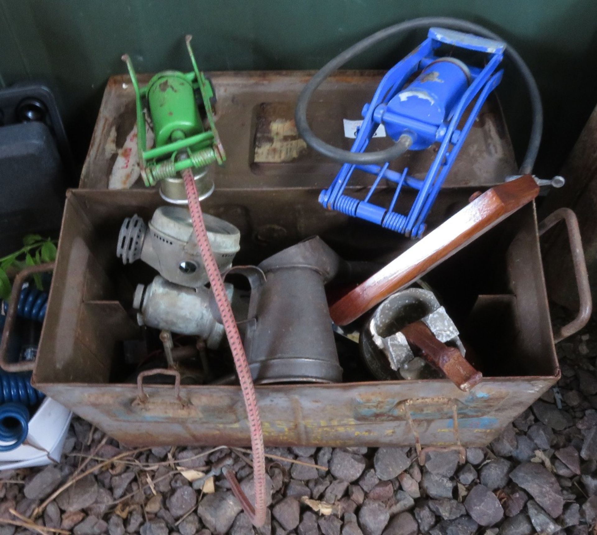 Ammunition box containing various vintage and veteran car parts including lamp, rear light