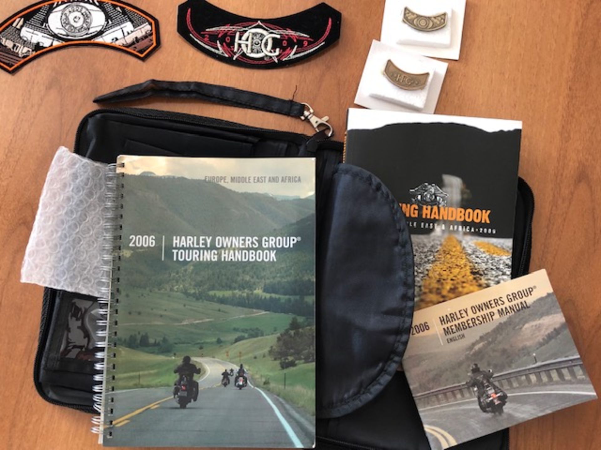 Harley Davidson pop up book in good condition and wallet containing H.O.G. books and badges - Image 4 of 4