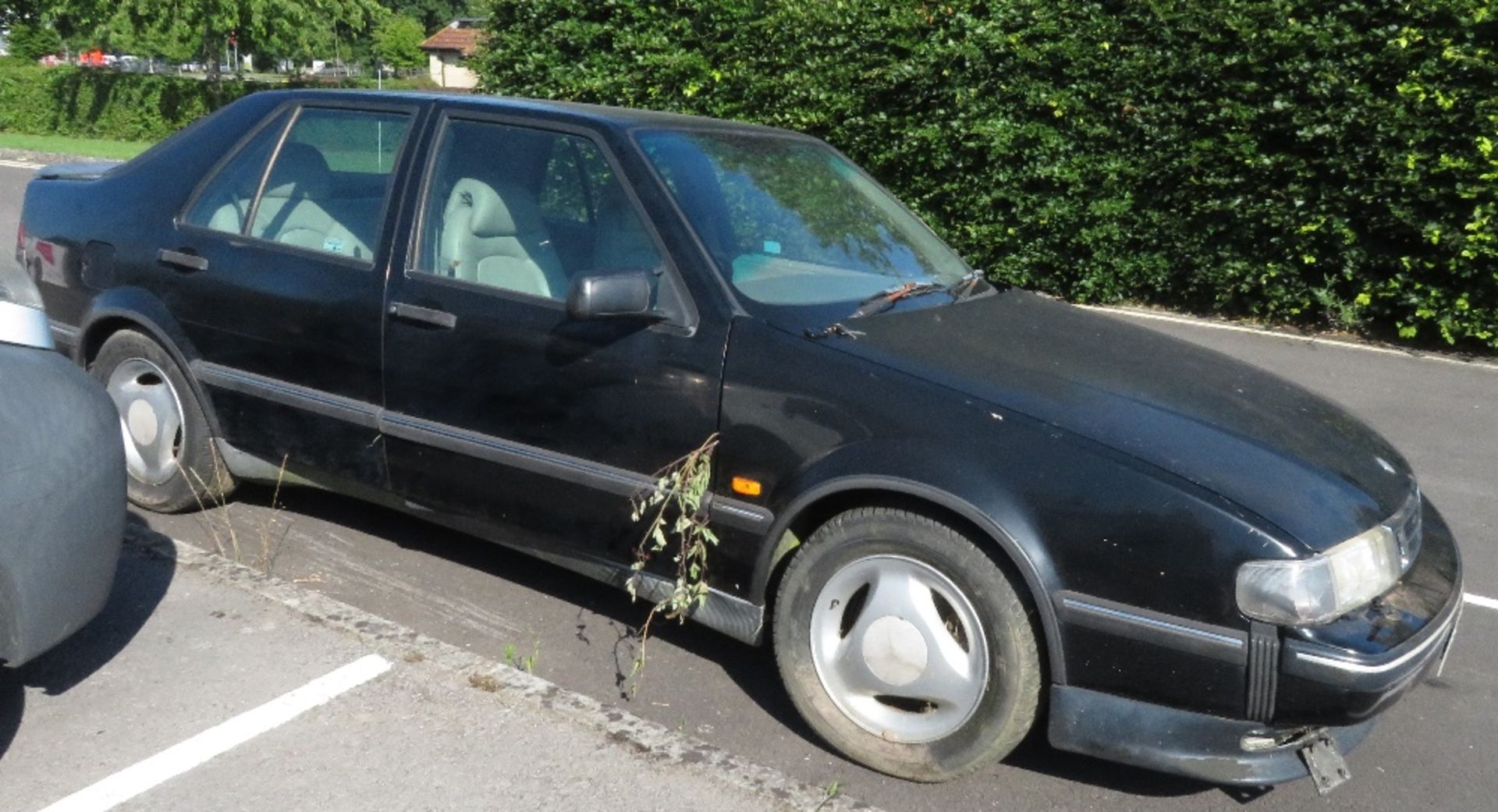 Saab 900 CSE, Reg no N855 CDB, black 4 door saloon, this vehicle has been stored in a field for many