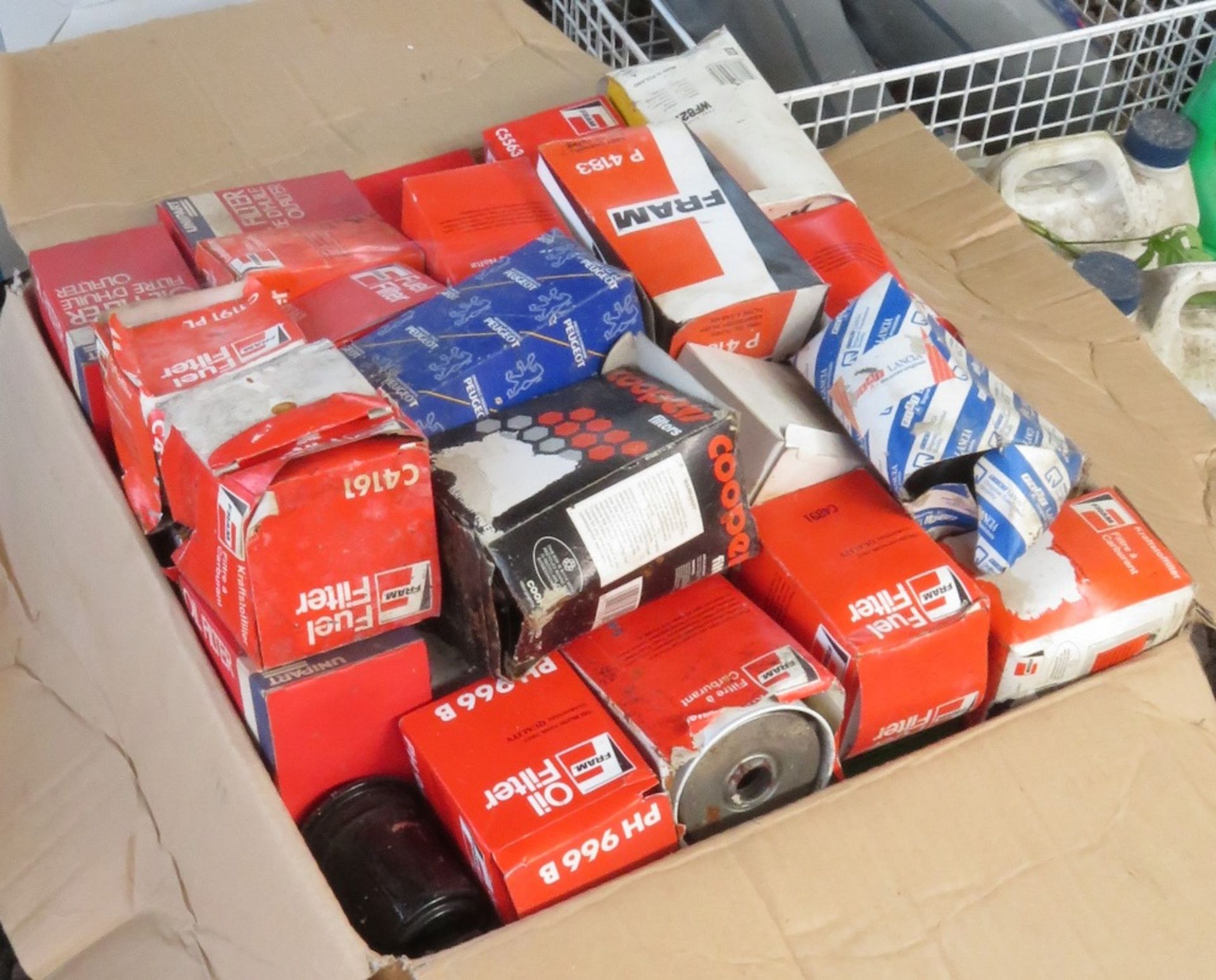 Large box of still boxed and unused fuel filters, air filters etc of various makes