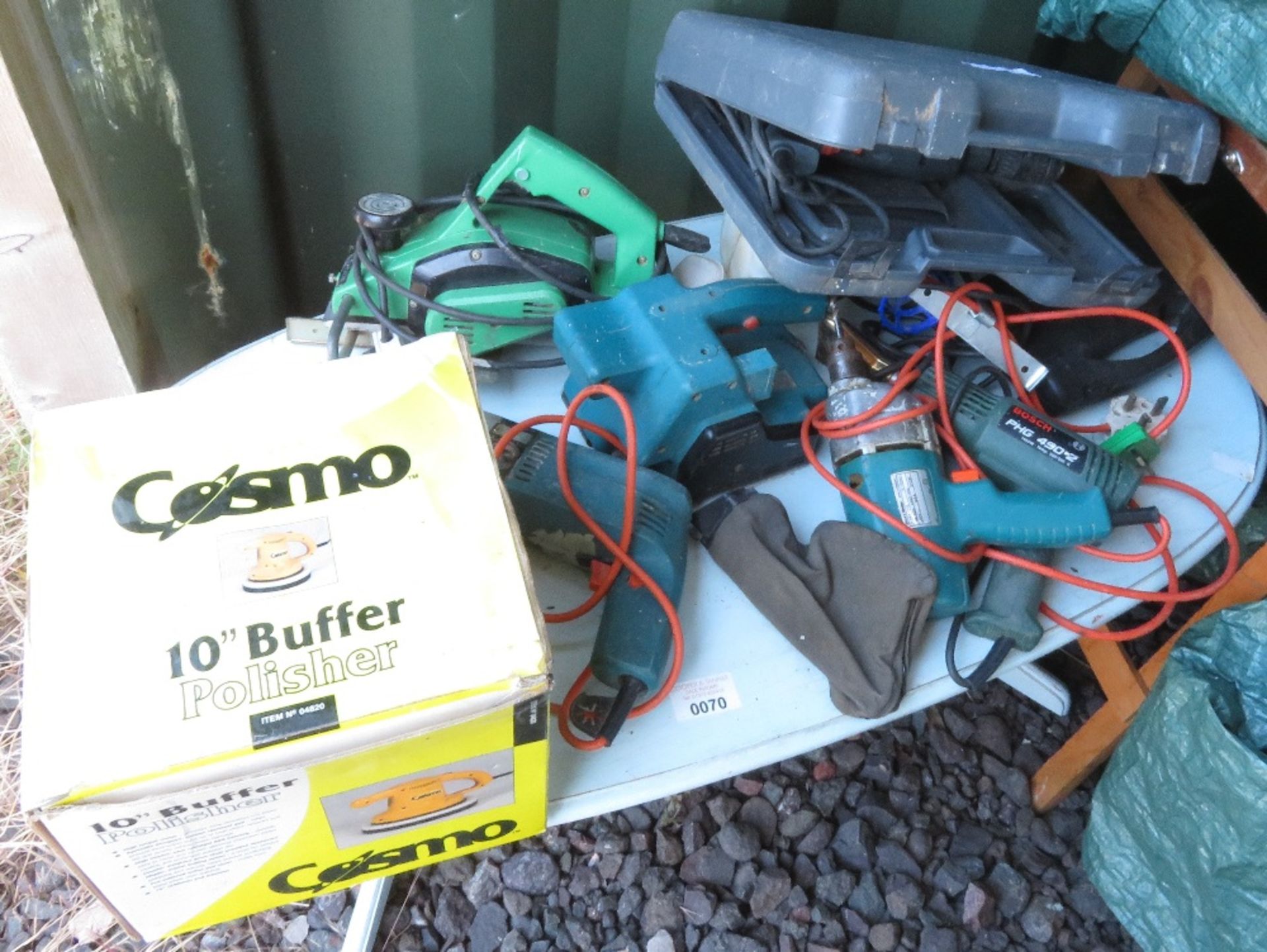 Table of various tools including heat gun, belt sander, 10” buffer polisher etc