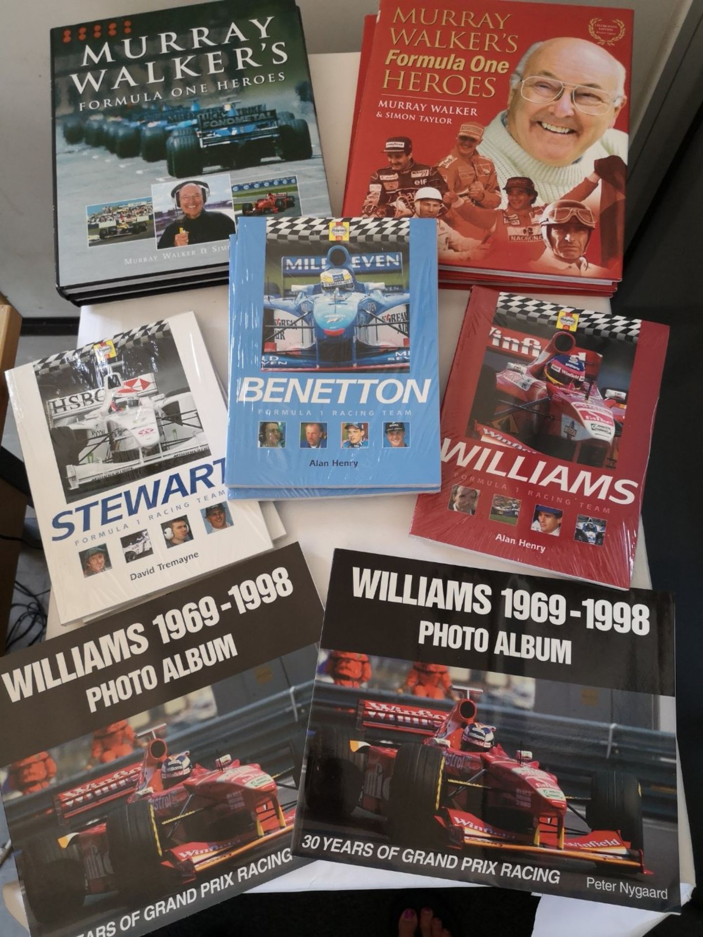 Selection of brand new motoring books including 2 Murray Walkers Formula 1 Hero's with red cover & 2