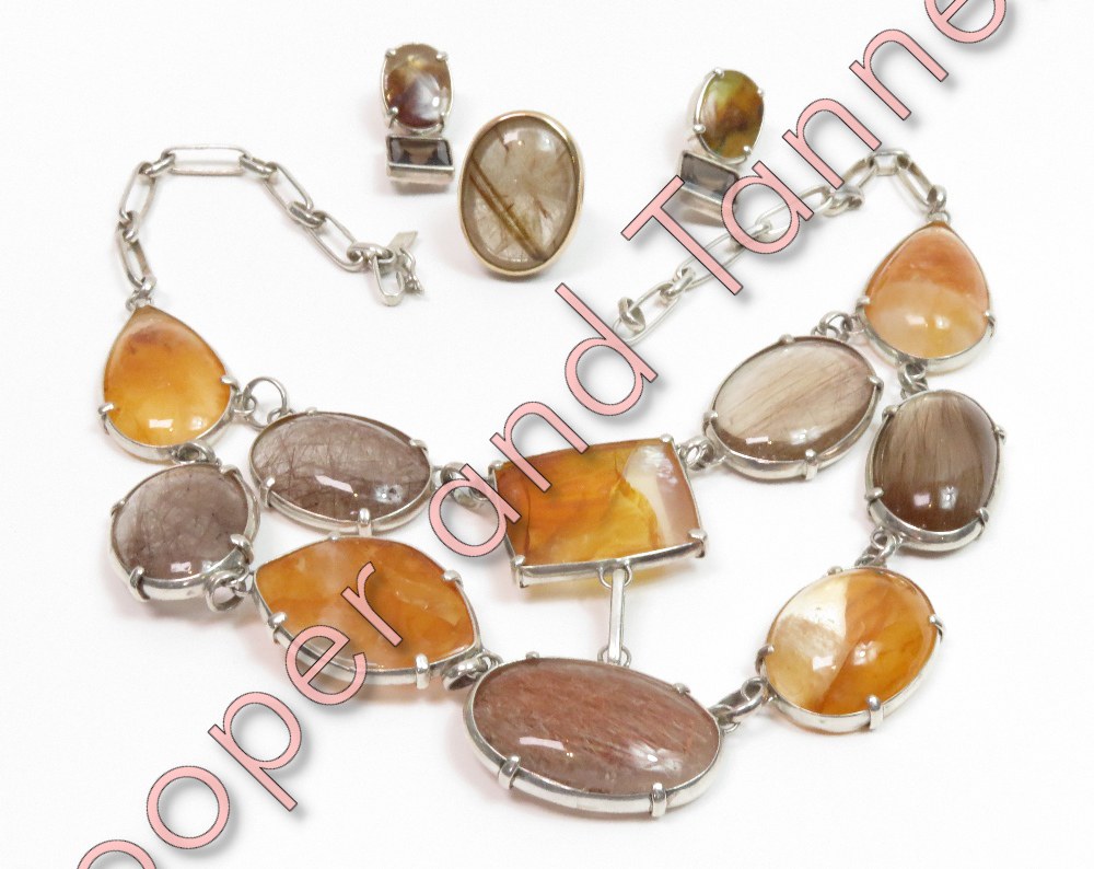 A suite of hardstone set jewellery, including rutilated quartz, comprising a necklace, ring and