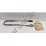 A pair of late 18th century silver sugar tongs, indistinct makers mark only, struck twice, with an