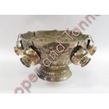 A silver plated punch bowl and six matching cups, standing on semi reeded circular base