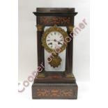 A 19th century French 'Portico' style 8 day mantle clock, enamel dial with decorative bezel and