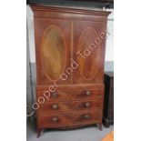 A George IV style inlaid mahogany linen press the top fitted with three sliding shelves the base