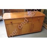 A lightwood sideboard with figured top over drawers and cupboards, mounted on casters, 65cms high