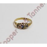 An Edwardian 18 carat gold five stone diamond and sapphire ring, Chester hallmark date letter